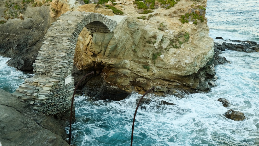 a large rock formation in the water
