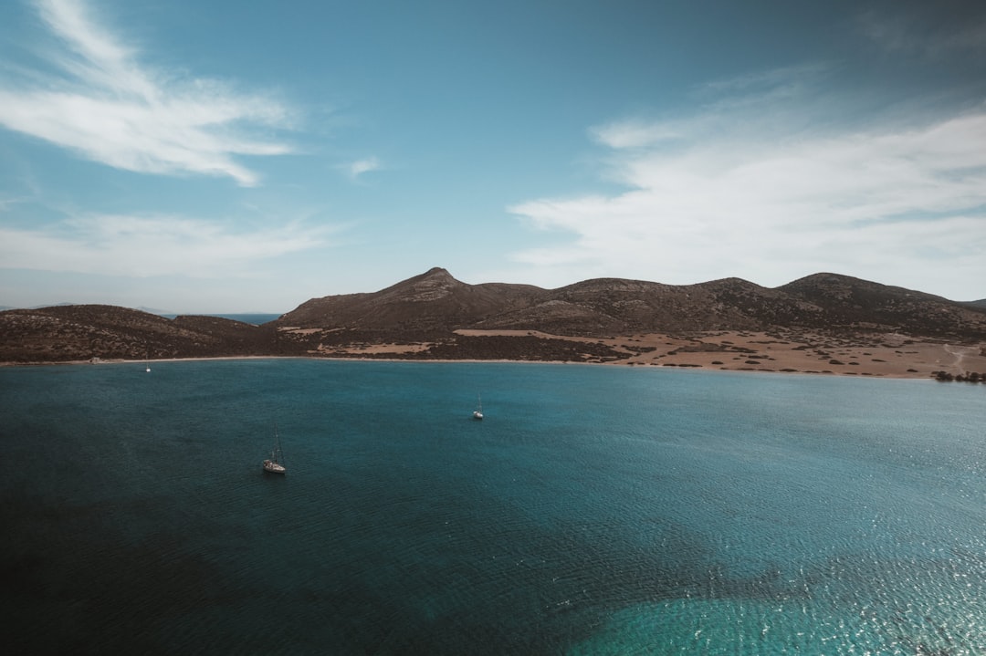 A large body of water surrounded by mountains