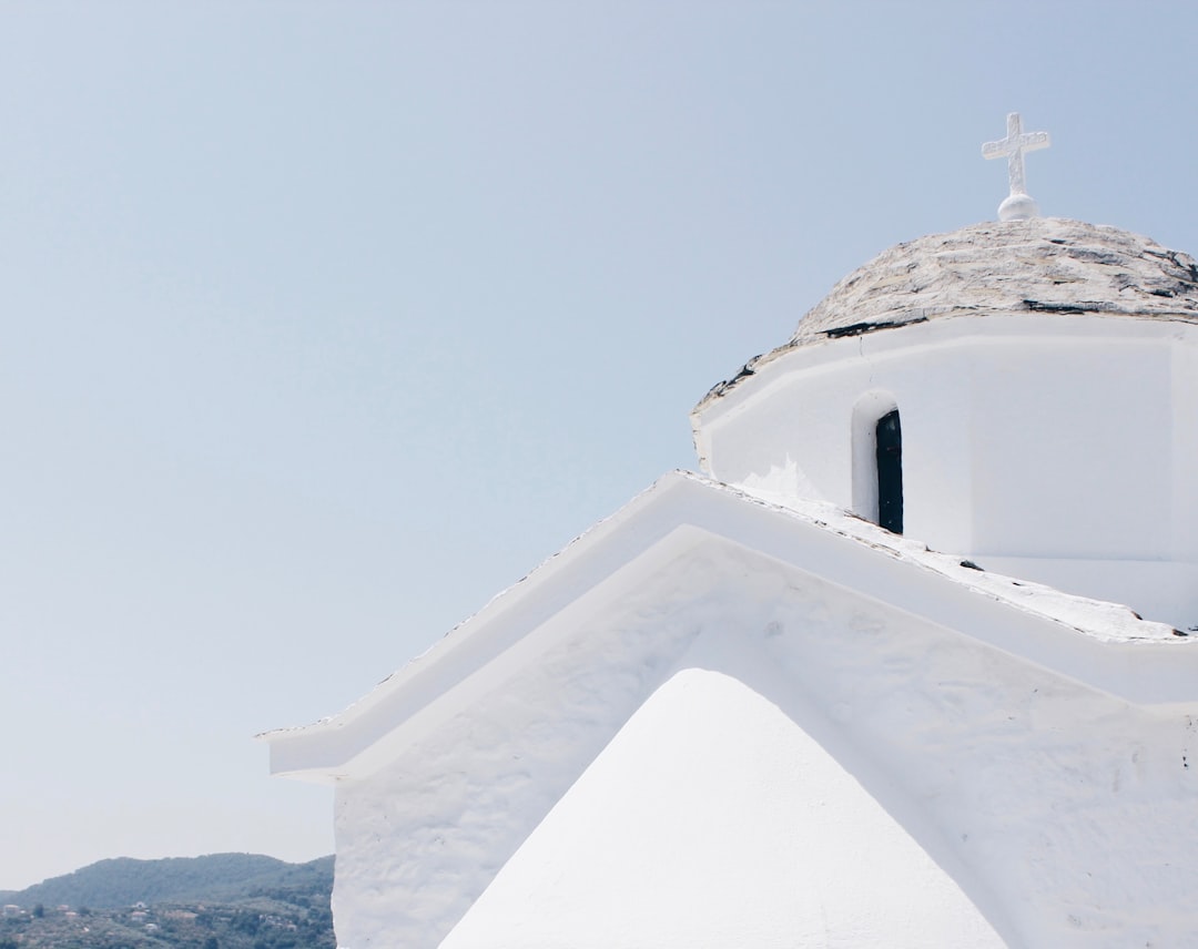 white concrete building under blue sky during daytime